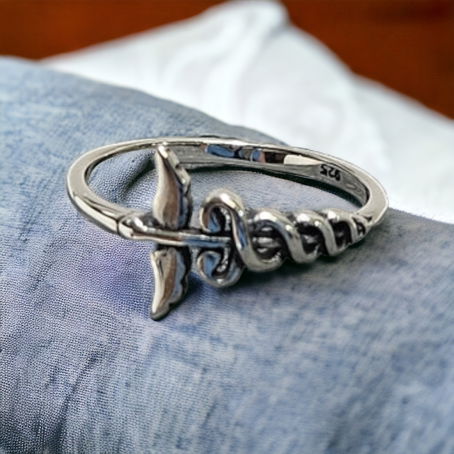 The caduceus symbol silver ring