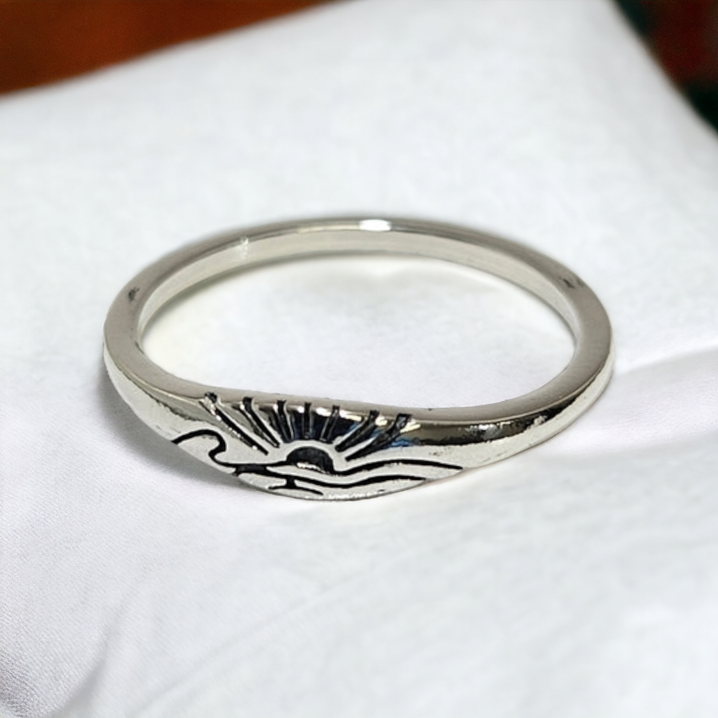 sunset over ocean laser cut silver ring