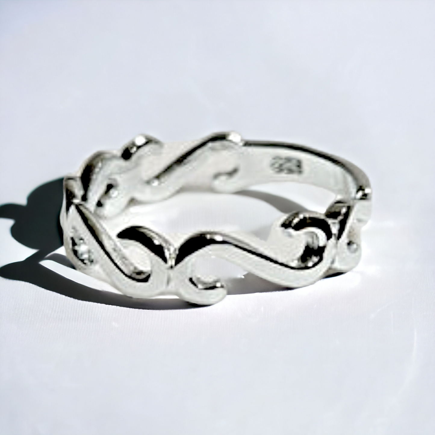 gruppetto symbol silver ring